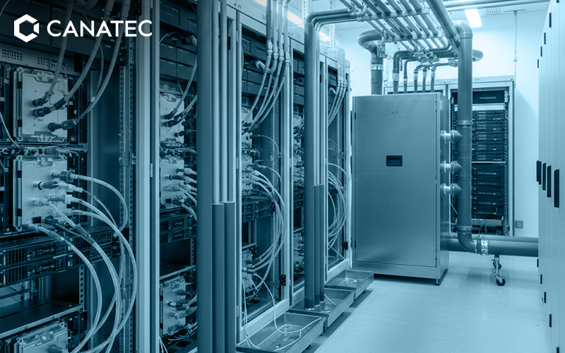 Liquid cooling pipes and server racks in a data centre.